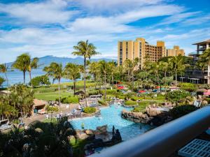 a view of the pool at a resort at Oceanfront Views Above Dukes - Wrap Around Lanai - Outdoor Kitchen Honua Kai H351 in Lahaina