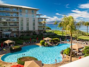an aerial view of the pool at the resort at Oceanfront Views Above Dukes - Wrap Around Lanai - Outdoor Kitchen Honua Kai H351 in Lahaina