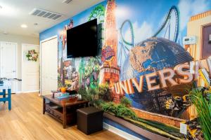 a living room with a large mural on the wall at Modern 5BR TwnHome w Private Pool Near Disney 358 in Kissimmee