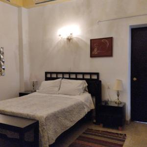 Ένα ή περισσότερα κρεβάτια σε δωμάτιο στο Casa Reforma en Oaxaca, México
