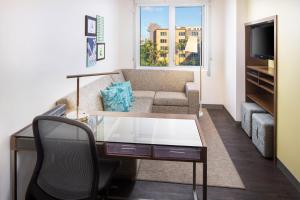 a living room with a couch and a table at Element Miami International Airport in Miami