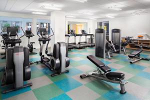 a gym with several treadmills and cardio machines at Element Miami International Airport in Miami