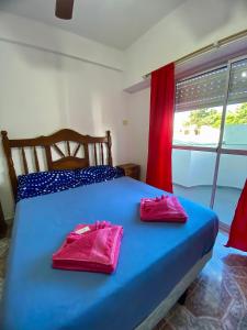 En eller flere senge i et værelse på HOTEL Cerdeña NUEVA FIRMA 2026