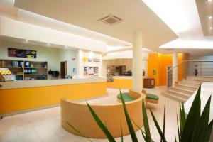 a lobby of a store with yellow and orange walls at Oasi D'Oriente in Santa Cesarea Terme