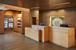 a lobby of a store with a reception desk at Fairfield Inn & Suites by Marriott Kansas City Belton in Belton +12 photos