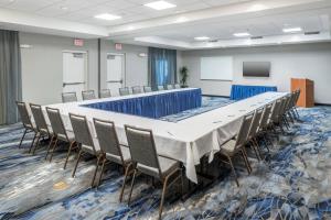 a large conference room with a long table and chairs at Fairfield Inn & Suites Kansas City Overland Park in Overland Park +16 photos