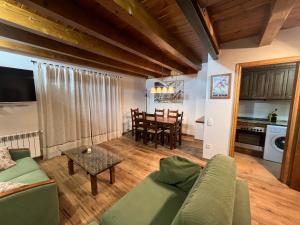 a living room with a couch and a table at Arties Luxury Apartments con jardín in Arties