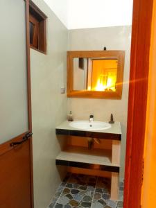 a bathroom with a sink and a mirror at Serendib Villa in Ahangama +36 photos