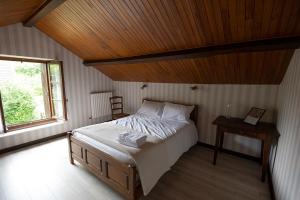 Postel nebo postele na pokoji v ubytování Le Roucadel