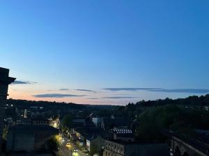 a view of a city at night at PENTHOUSE APARTMENT - FREE GARAGED Parking - BALCONY - GYM in Dewsbury
