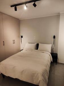 Postel nebo postele na pokoji v ubytování Pavliani Apartments