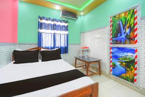 Postel nebo postele na pokoji v ubytování Hotel O Yuvraj Lodge