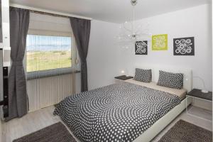 Ένα ή περισσότερα κρεβάτια σε δωμάτιο στο Apartments & Rooms Laganini SARA +68 φωτογραφίες