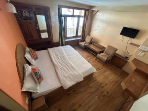 TV a/nebo společenská místnost v ubytování Hotel BHRIGU