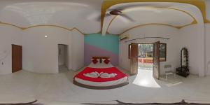 Una cama o camas en una habitación de Esther Guest House