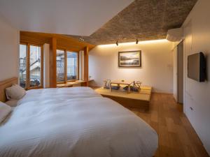 Postel nebo postele na pokoji v ubytování TSUCHIYA Kinosaki onsen + 37 fotografií