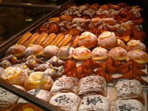 a display case filled with lots of different types of donuts at Lanza in Catania