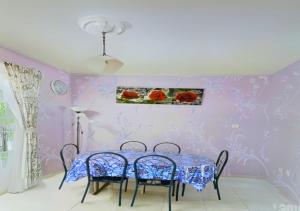 a dining room with a blue table and chairs at NO DEPOSIT - BIG Home 2-sty Terrace Near World Theme Park Hot Springs & Night Park max 6person in Ipoh +55 photos