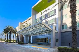 a building with palm trees in front of it at Element by Marriott Ontario in Ontario