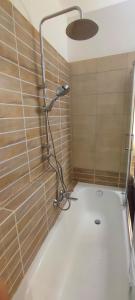a shower with a glass door in a bathroom at The Garden of Zephyrus - West in Kounoupidhianá +34 photos