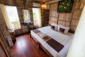 Giường trong phòng chung tại Royal JJ Ubud Resort & Spa +51 ảnh