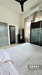 Postelja oz. postelje v sobi nastanitve SERAI Homestay