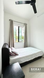 Postelja oz. postelje v sobi nastanitve SERAI Homestay