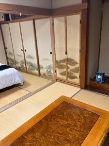 Postel nebo postele na pokoji v ubytování Private Lodging KASE 五所川原