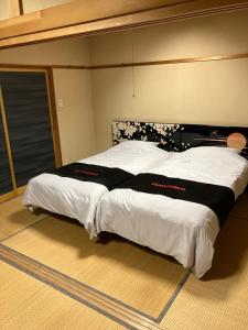 Postel nebo postele na pokoji v ubytování Private Lodging KASE 五所川原