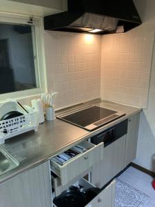 Kuchyň nebo kuchyňský kout v ubytování Private Lodging KASE 五所川原