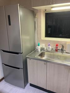Kuchyň nebo kuchyňský kout v ubytování Private Lodging KASE 五所川原