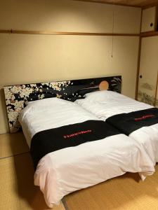 Postel nebo postele na pokoji v ubytování Private Lodging KASE 五所川原