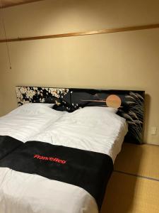 Postel nebo postele na pokoji v ubytování Private Lodging KASE 五所川原