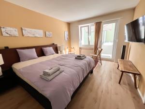 UP&GREAT Apartments - Stylish City Living客房内的一张或多张床位