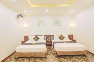 Ένα ή περισσότερα κρεβάτια σε δωμάτιο στο One Villa 3 Hotel Hà Nội