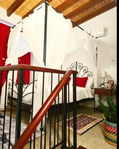 a bedroom with a bed with a canopy at Kozakos Luxury House in Pano Lefkara