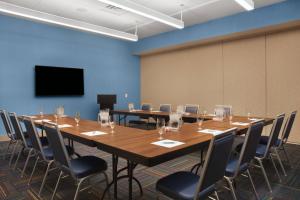 a large conference room with a long table and chairs at Four Points by Sheraton Fort Lauderdale Airport/Cruise Port in Fort Lauderdale