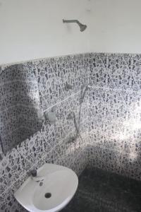 a bathroom with a sink and a shower at VIHANSHA Guesthouse in Weligama +9 photos