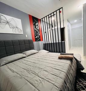 a bedroom with a large bed in a room at People's Condo Atria in Iloilo City