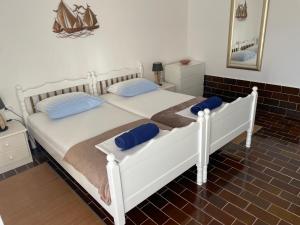 Postel nebo postele na pokoji v ubytování Guesthouse Antonija