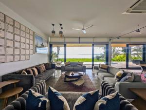 a living room with couches and a table at Ira Kabini by Luxunlock Private Villas in Antarasante +38 photos