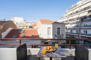 a plate of food on a table on a balcony at Amara Local Experience in Chania Town
