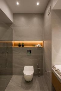 a bathroom with a toilet and a sink at Amara Local Experience in Chania Town