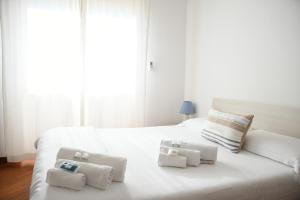 Ένα ή περισσότερα κρεβάτια σε δωμάτιο στο House Rome front sea +68 φωτογραφίες