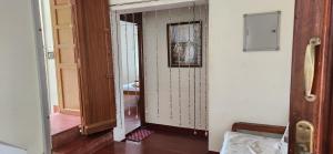 a hallway with an open door to a room at Angel Beach Villas - Pondicherry in Puducherry +13 photos