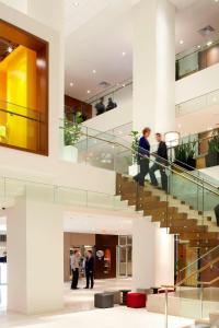 people walking up and down stairs in a building at Delta Hotels by Marriott Ottawa City Centre in Ottawa +37 photos