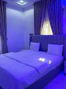 Postel nebo postele na pokoji v ubytování Dasah Apartment