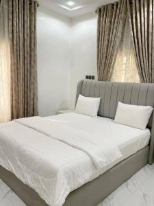Postel nebo postele na pokoji v ubytování Dasah Apartment