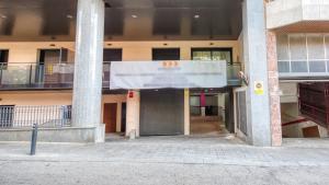 an entrance to a building with a sign on it at Costacabana - Apartment Dali in Lloret de Mar +3 photos