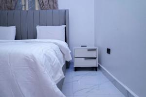 Postel nebo postele na pokoji v ubytování Dasah Apartment